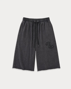 Front view of Lobby Shorts in heavy cotton sweat fabric featuring a long, wide-leg relaxed silhouette with deep pockets