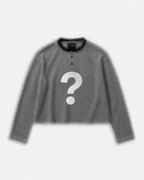 Pixelated flatlay of an Aston Abode Box Henley with a question mark across the chest
