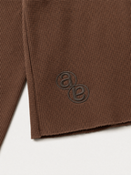 Box Henley Cedar — tonal AB monogram embroidery at the lower back
