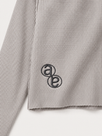 Box Henley Stone — tonal AB monogram embroidery at the lower back
