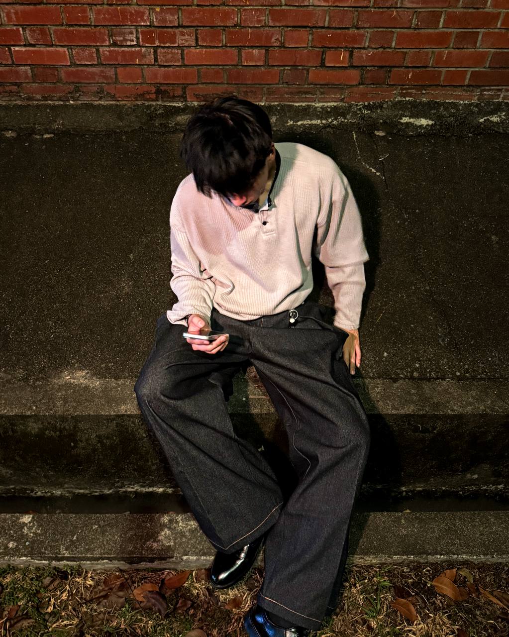 Box Henley Stone worn on model — seated street shot