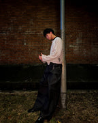 Box Henley Stone worn on model — side profile street shot