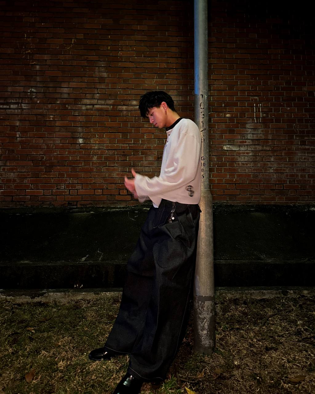 Box Henley Stone worn on model — side profile street shot