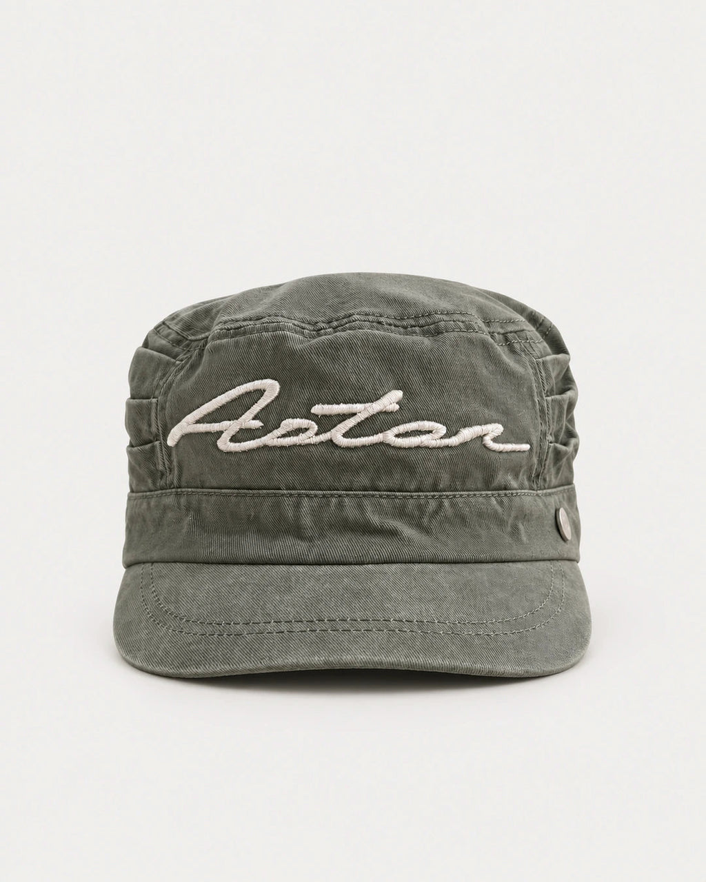 Field Kepi Cap front view in washed field-green cotton twill with Aston script embroidery