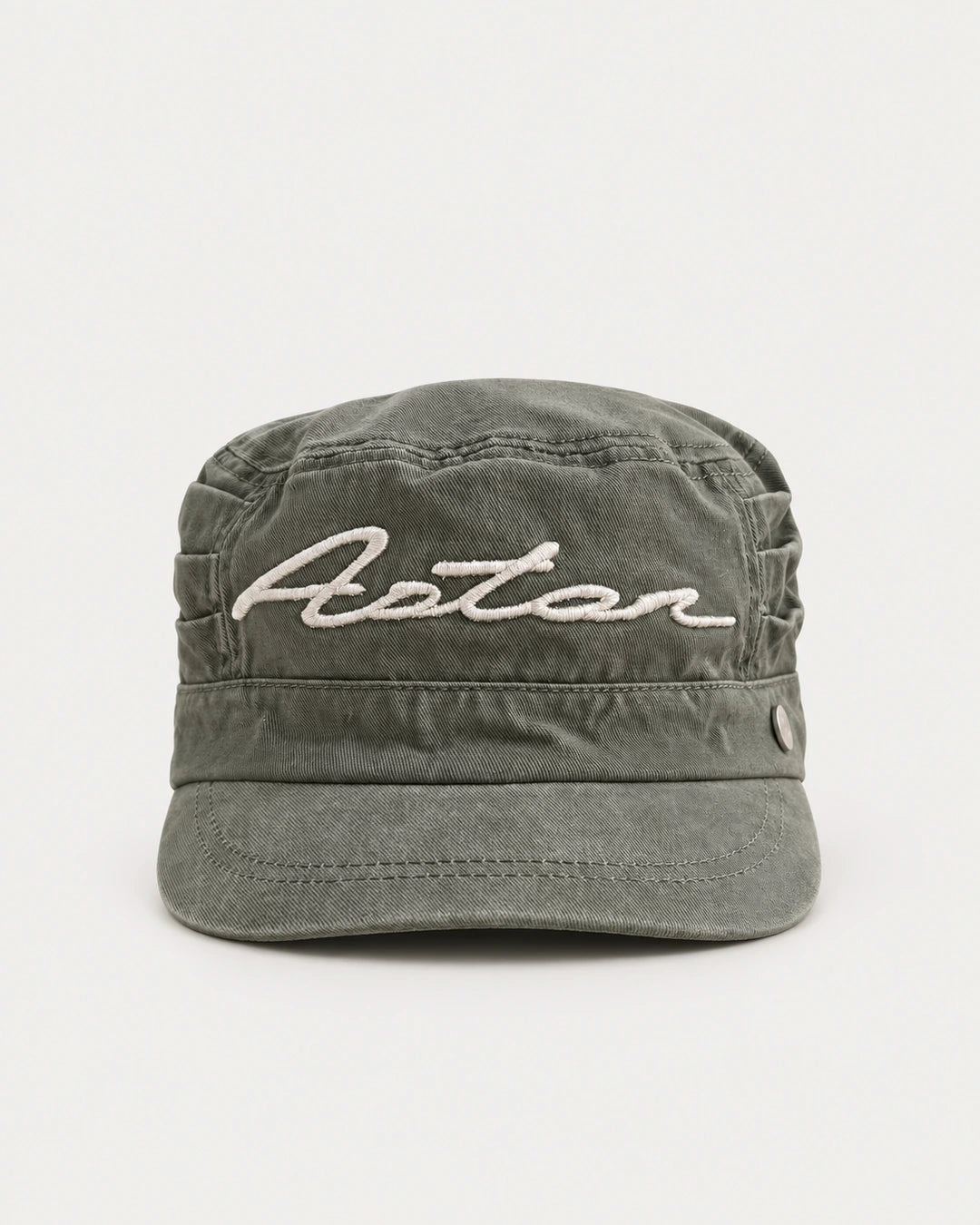 Field Kepi Cap front view in washed field-green cotton twill with Aston script embroidery