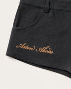 Sidebar Microshorts gold Aston Abode script embroidery detail