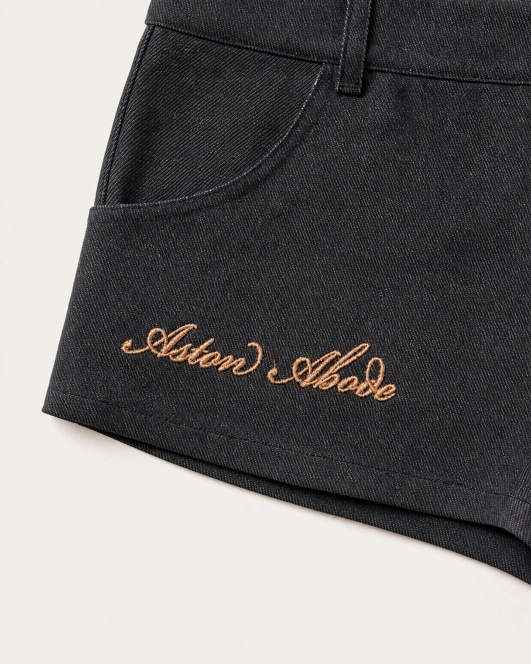 Sidebar Microshorts gold Aston Abode script embroidery detail