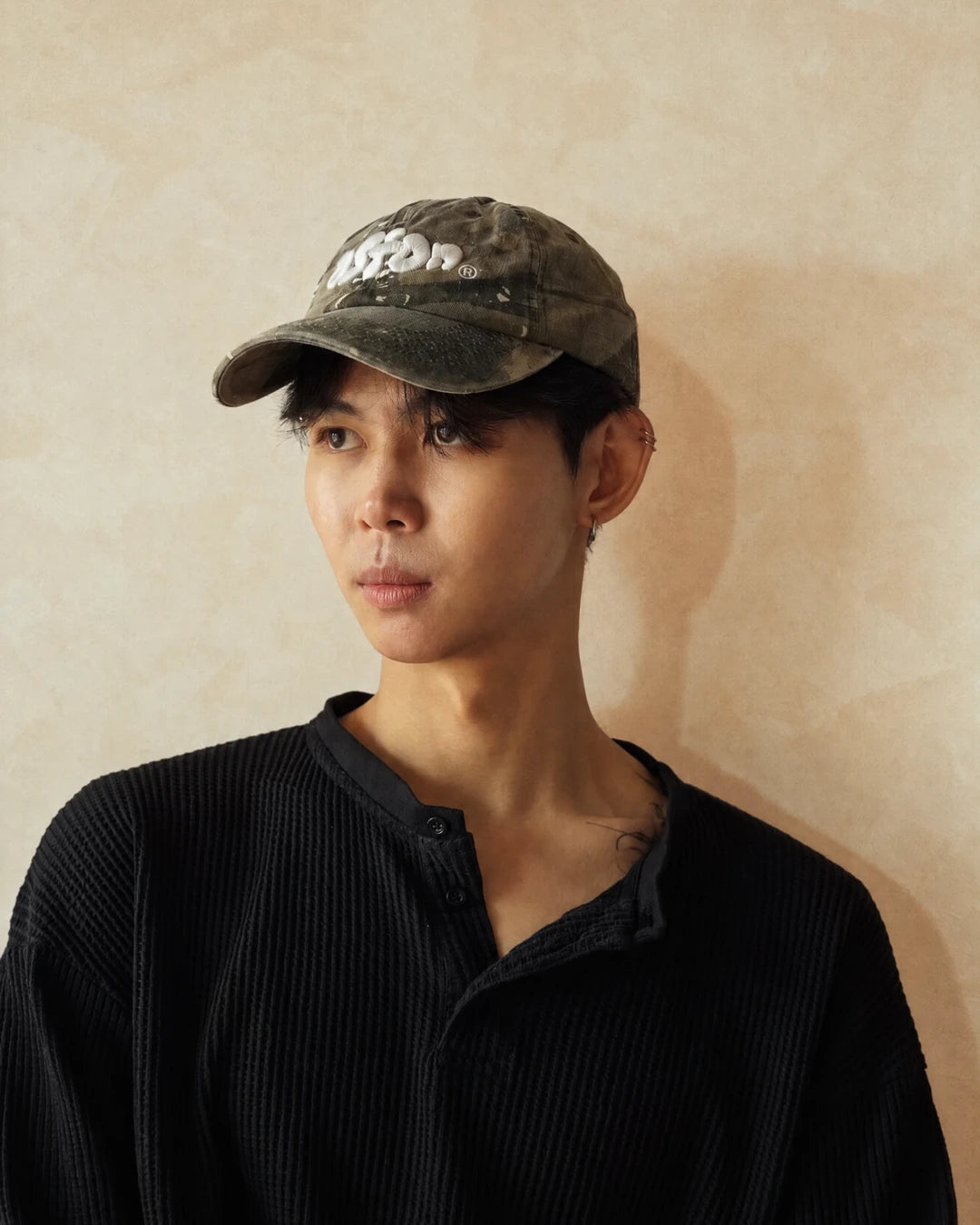 Staple Cap Real Tree worn on model, three-quarter view
