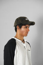 Aston Abode Staple Cap in Terrain, lifestyle shot on Aarav