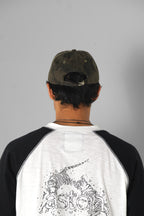 Aston Abode Staple Cap in Terrain, lifestyle shot on Aarav