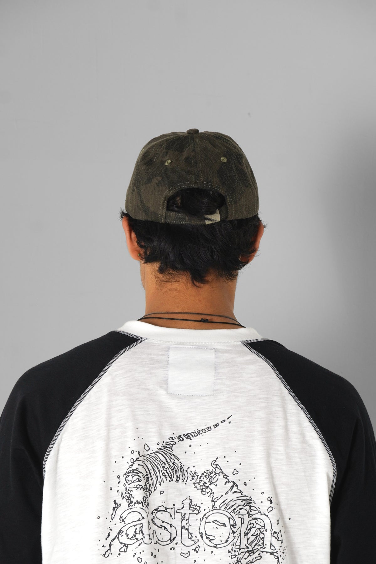Aston Abode Staple Cap in Terrain, lifestyle shot on Aarav