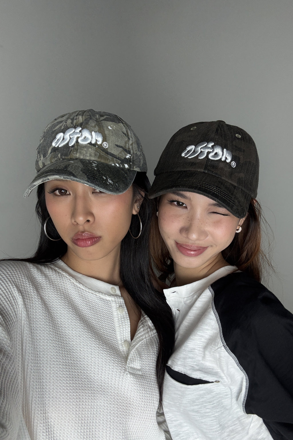 Aston Abode Staple Cap in Terrain, lifestyle shot on Hera and Clarice