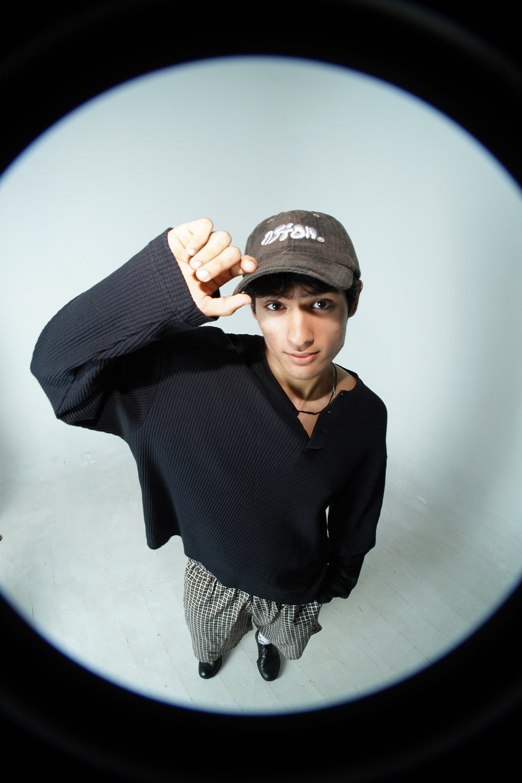 Aston Abode Staple Cap in Terrain, lifestyle shot on Aarav