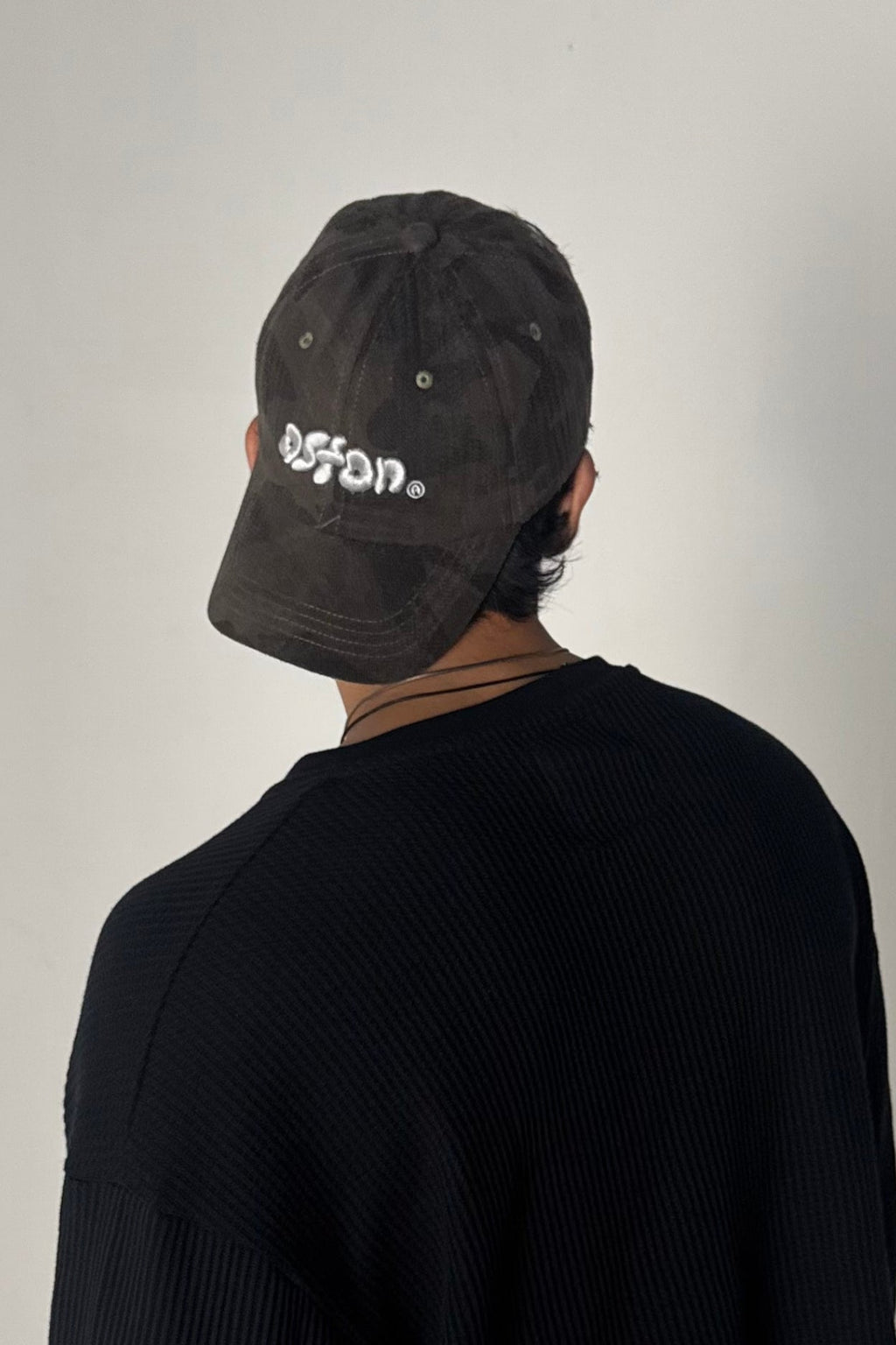 Aston Abode Staple Cap in Terrain, lifestyle shot on Aarav