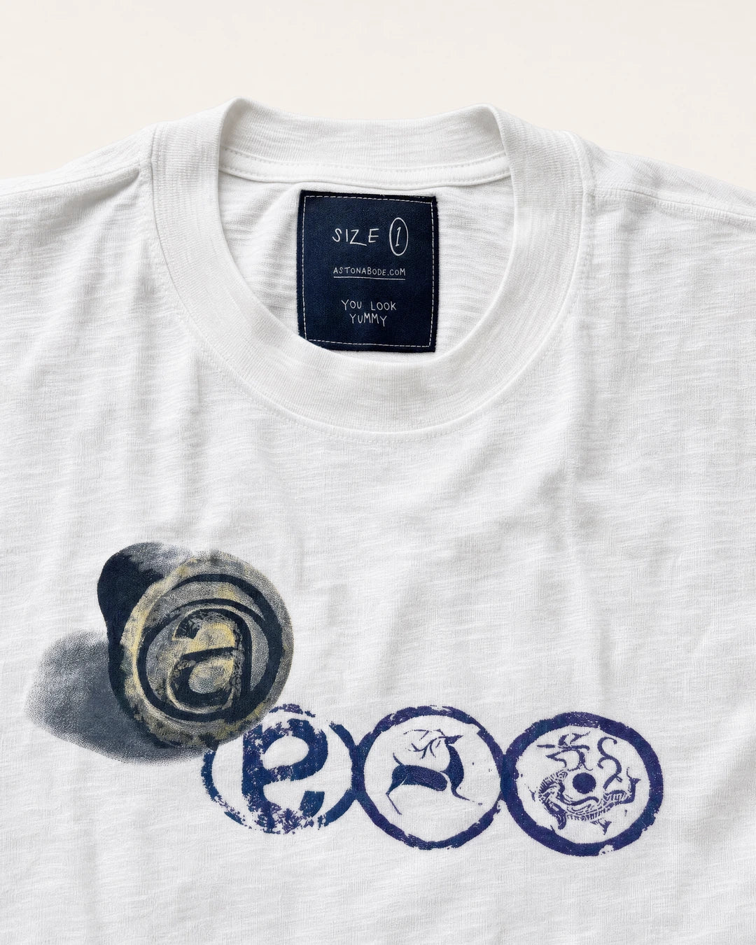 Wadang Tee collar, size label and hand-stamped wadang chest print detail