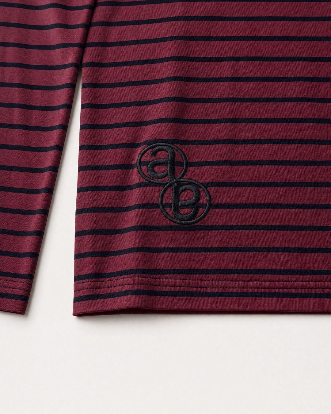 Wine Henley tonal AB monogram embroidery at the lower back