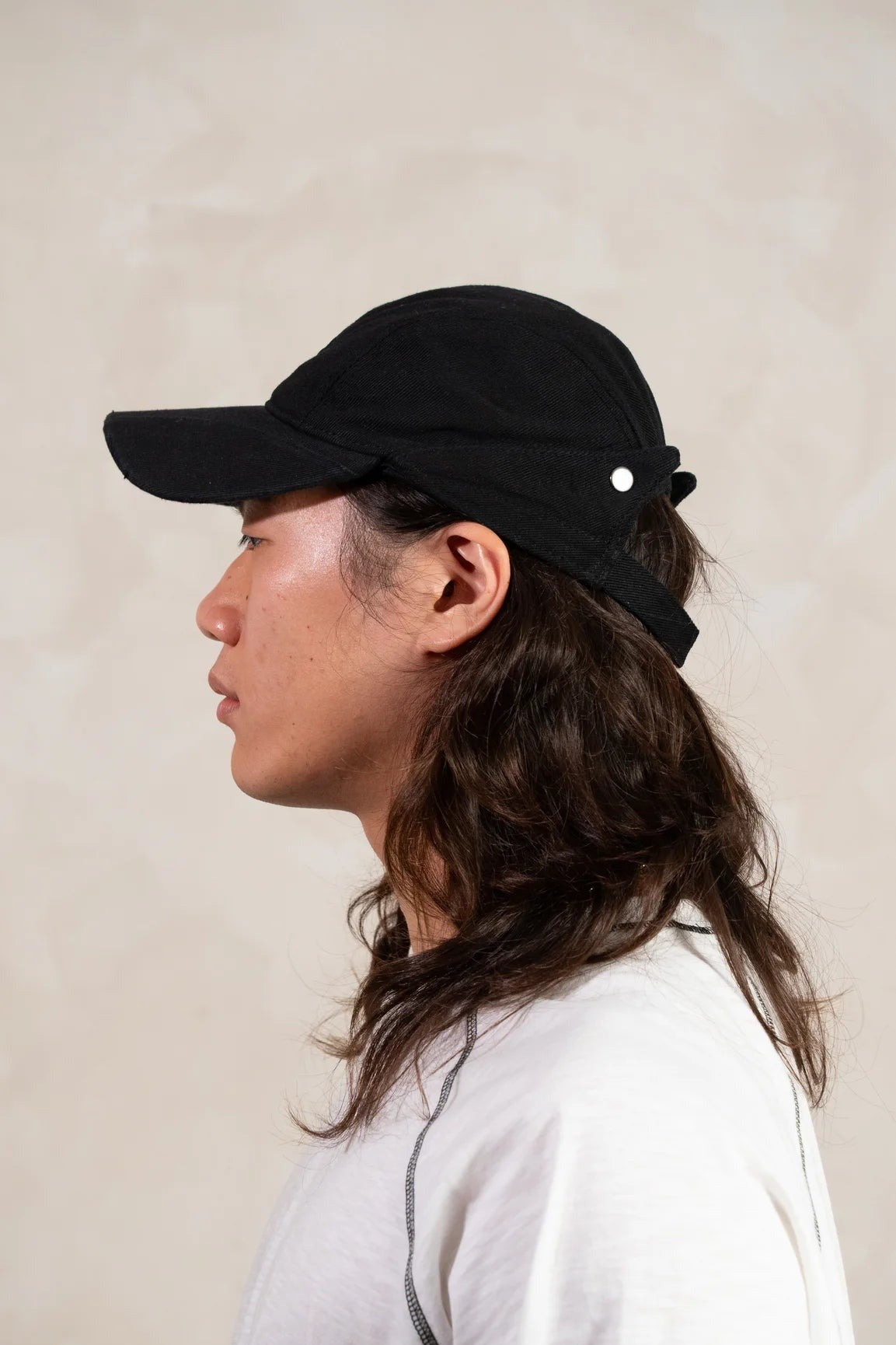 Aston Abode Banana Cap in Charcoal, side view, worn
